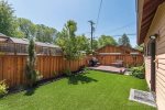 Fenced backyard with patio, barbeque, chairs, fire pit bring your firewood